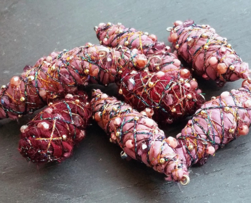 purple pink fiber art beads